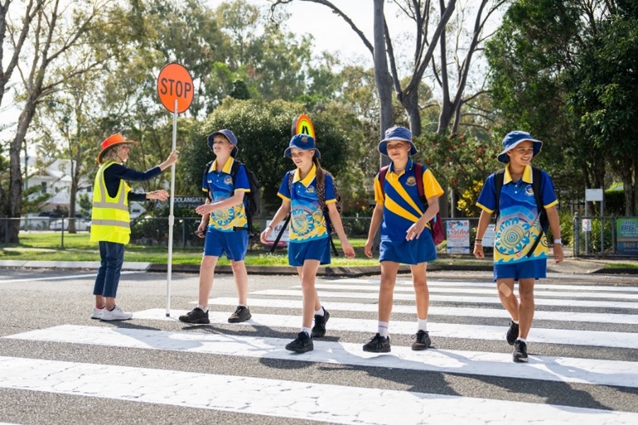 Children crossing the road at a school crossing.