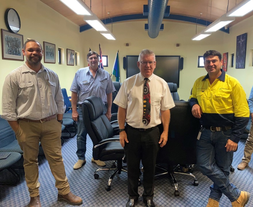 Director-General, Neil Scales (second from right) on his recent visit to Woorabinda in February 2021 with Mayor of Woorabinda, Joshua Weazel (far left)