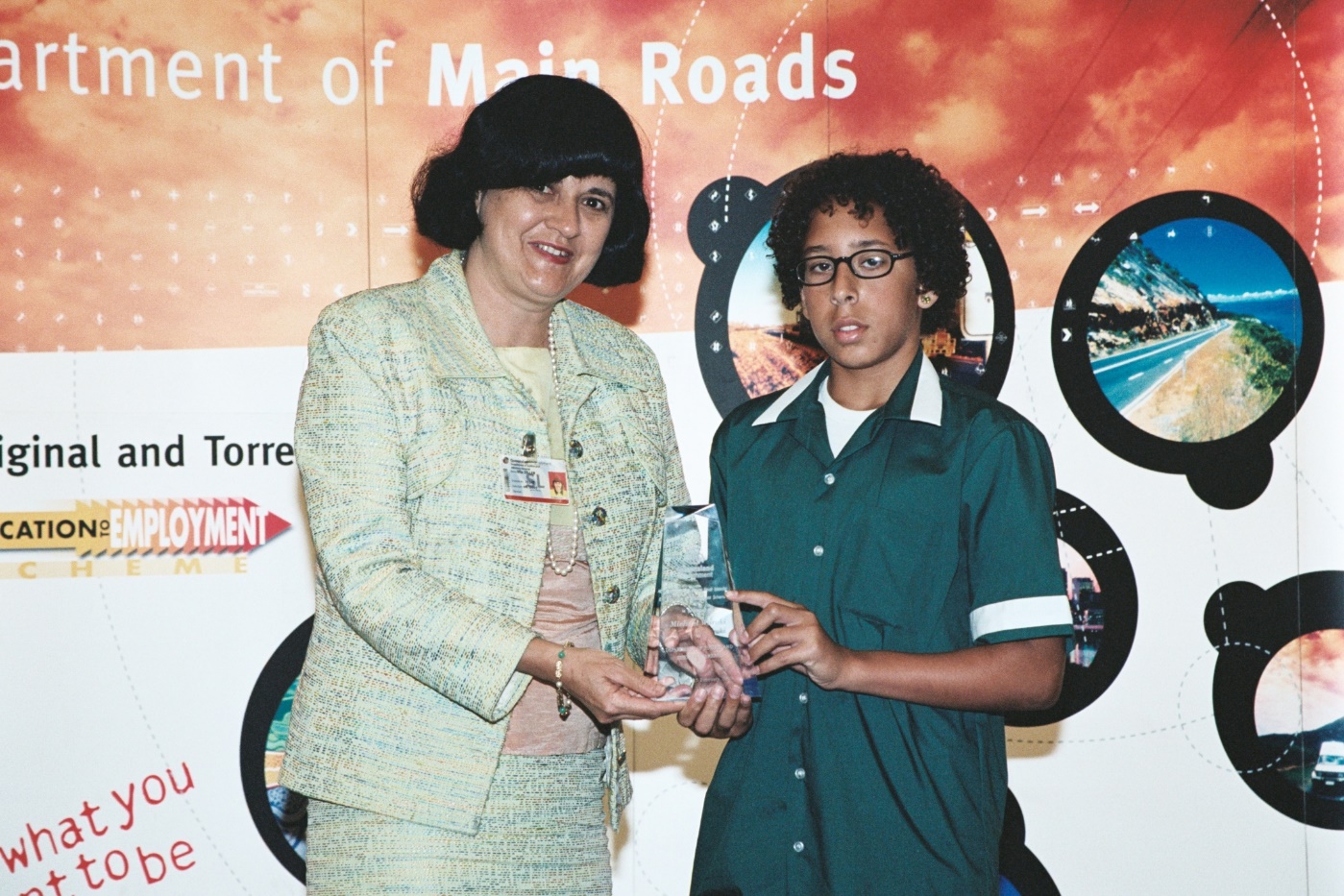 A person presenting an award to a student