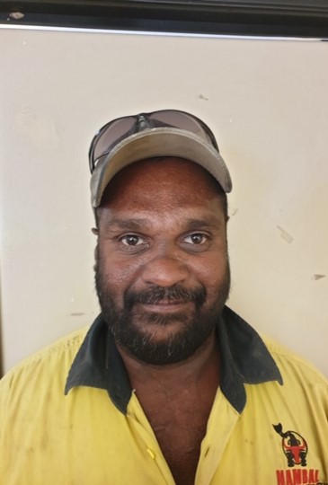 A person with a yellow shirt