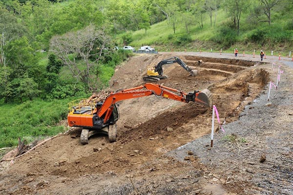 Preparing to add new material to stabilise the embankment.