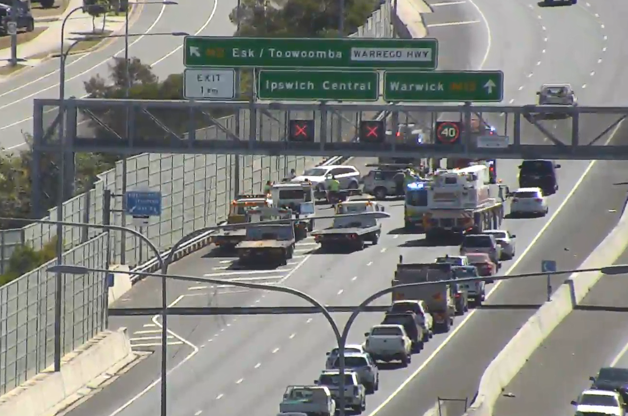 Lane use management signs on a motorway showing closed lanes indicated by red crosses.