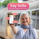 Woman holding phone pointing at the screen. Speech bubble says ‘Say hello, Queensland’s Digital Licence is here’ with three smaller speech bubbles saying ‘easy’, ‘free’, ‘secure’
