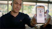 Someone holding a smartphone, showing the Digital Licence app