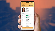 A hand holding a phone with a digital driver licence on the screen. A person's photo is in the top left of the screen. Information such as Status, Age, Class and Excpiry are on the screen