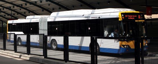 Photograph of the side view of an articulated bus
