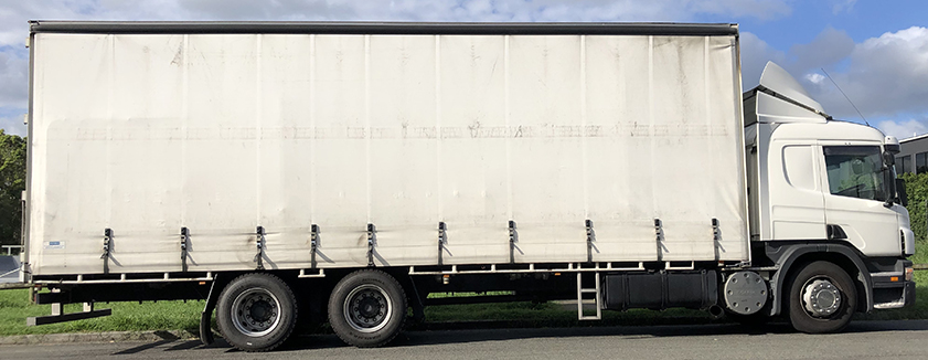 Photograph of side view of a rigid truck