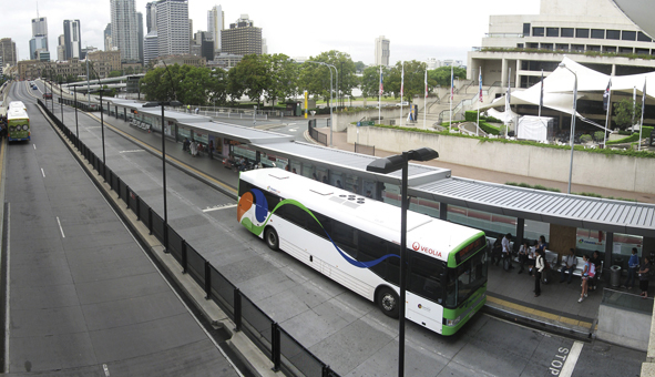 Picture of a bus at the South Bank Bus Station with the city in the background