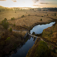 Aerial photo of creek near trail