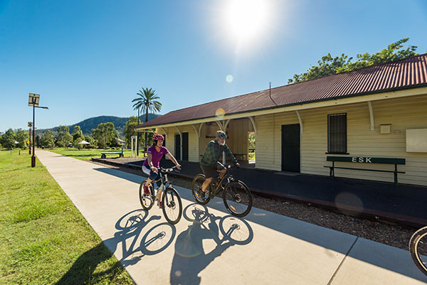 Image of a building with a wide concrete path running parallel
