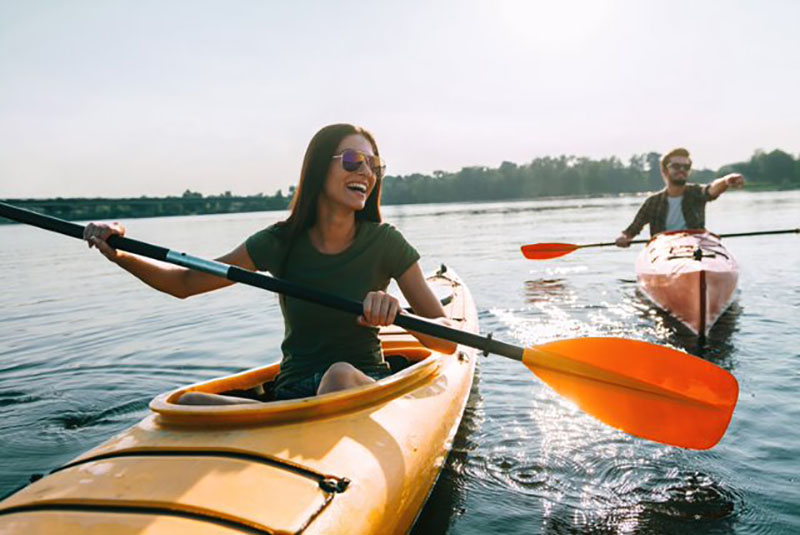 2 people canoeing on the water