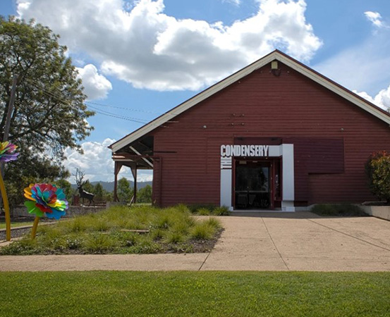 A red building with a sign "Somerset Regional Art Gallery - The Condensery"
