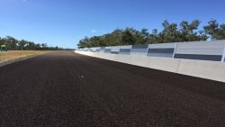 Aluminium panels on a roadside noise barrier.
