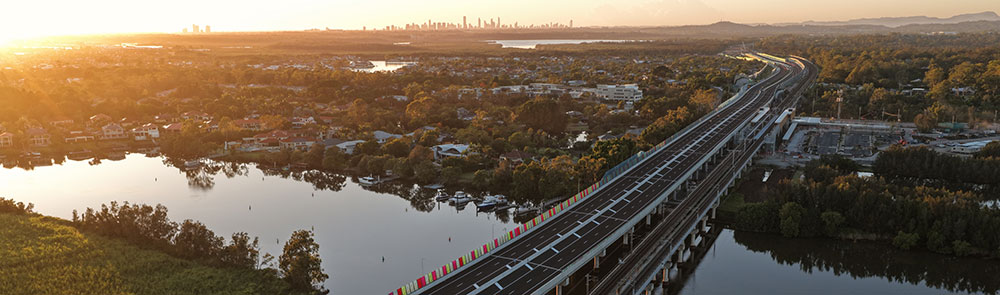 Sunrise over a multi-lane bridge.