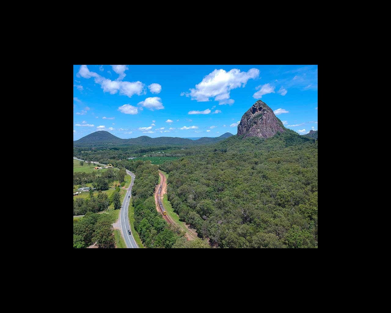  The North Coast Line meanders through the Glass House Mountains  