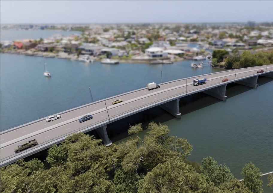Overhead view of vehicles using a bridge over a waterway.