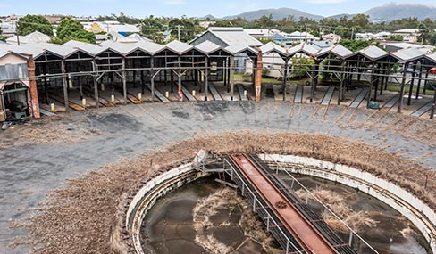 Rockhampton Railyards Heritage Precinct Roundhouse Close-up view of the historic, disused roundhouse at the Rockhampton Railyards Heritage site, featuring a circular structure with a stationary turntable in the center