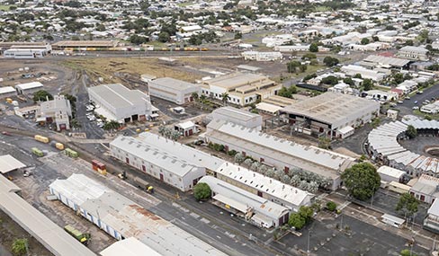 Industrial precinct Rockhampton railyards Aerial view of the Rockhampton Railyards industrial precinct, showcasing rail tracks, various structures, and the historic circular roundhouse