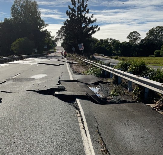 Floodwater caused major pavement damage on Brisbane–Woodford Road at Bald Hills Flats.