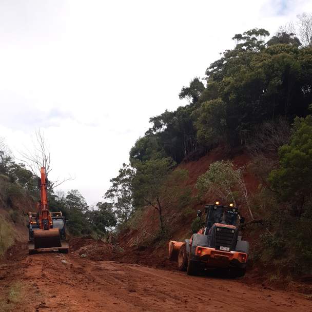 Crews clearing the road after heavy rainfall caused a landslip on Esk–Hampton Road.
