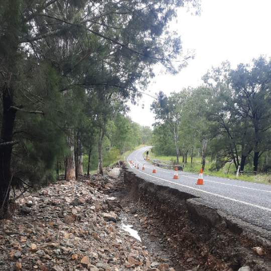 Floodwater severely scoured the road shoulder on the Isis Highway (Childers–Biggenden).