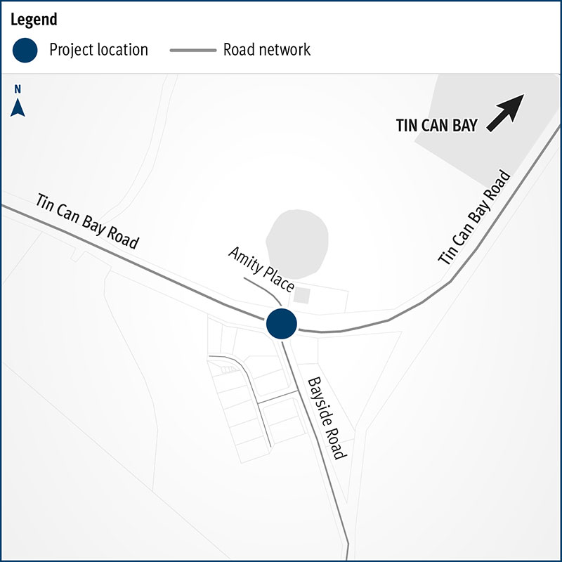 The map shows a navy dot at the intersection of Tin Can Bay Road, Amity Place and Bayside Road intersection in Cooloola Cove where a new single-lane roundabout will be constructed.