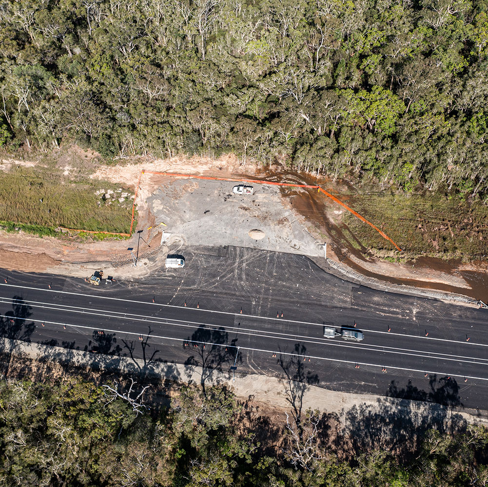 Aerial image of Torbanlea site location, dense forestry with road traveling through. 