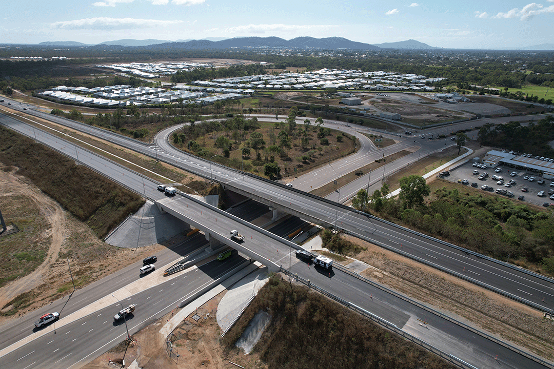 Hervey Range Developmental Road interchange (looking north), photo shows two overpasses and traffic traveling across the overpasses and underneath