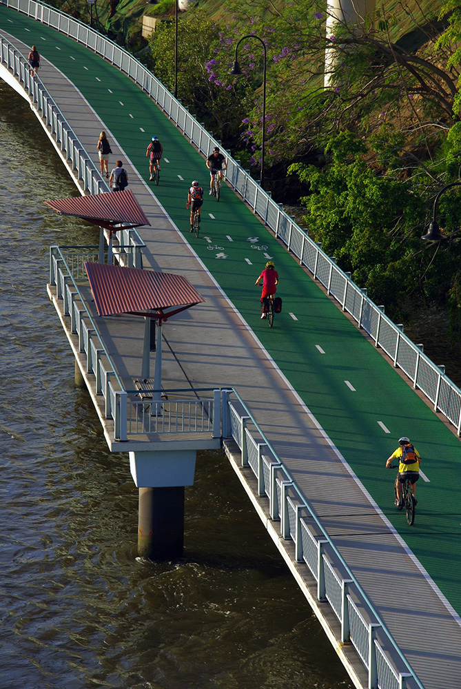 Image showing bike riding and runners using the Bicentennial Bikeway beside Brisbane River.