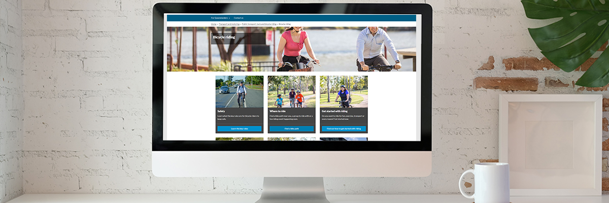 A computer screen showing a webpage with images of people on bikes over headings and links.